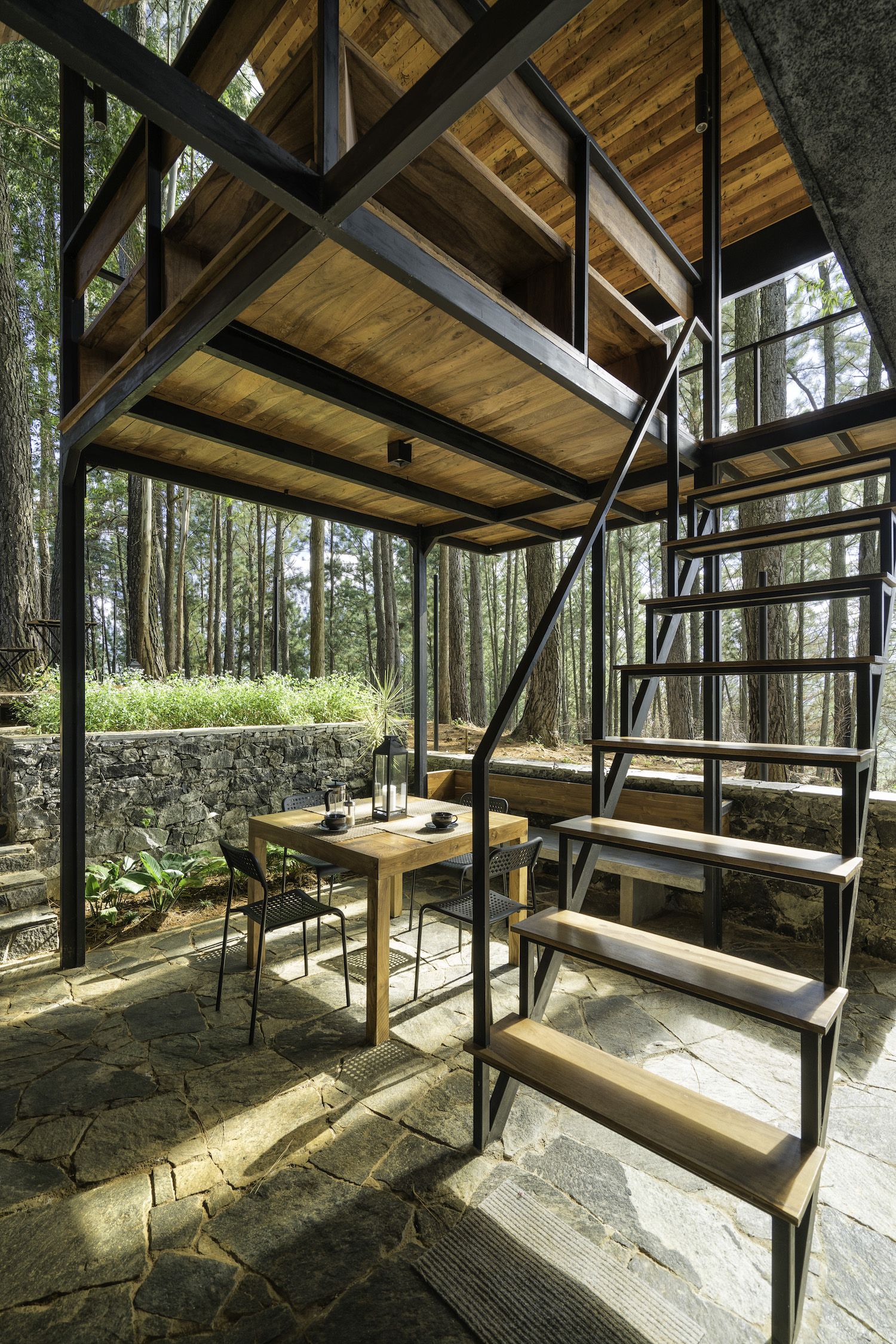 timber wood table and outdoor chairs with forest view 