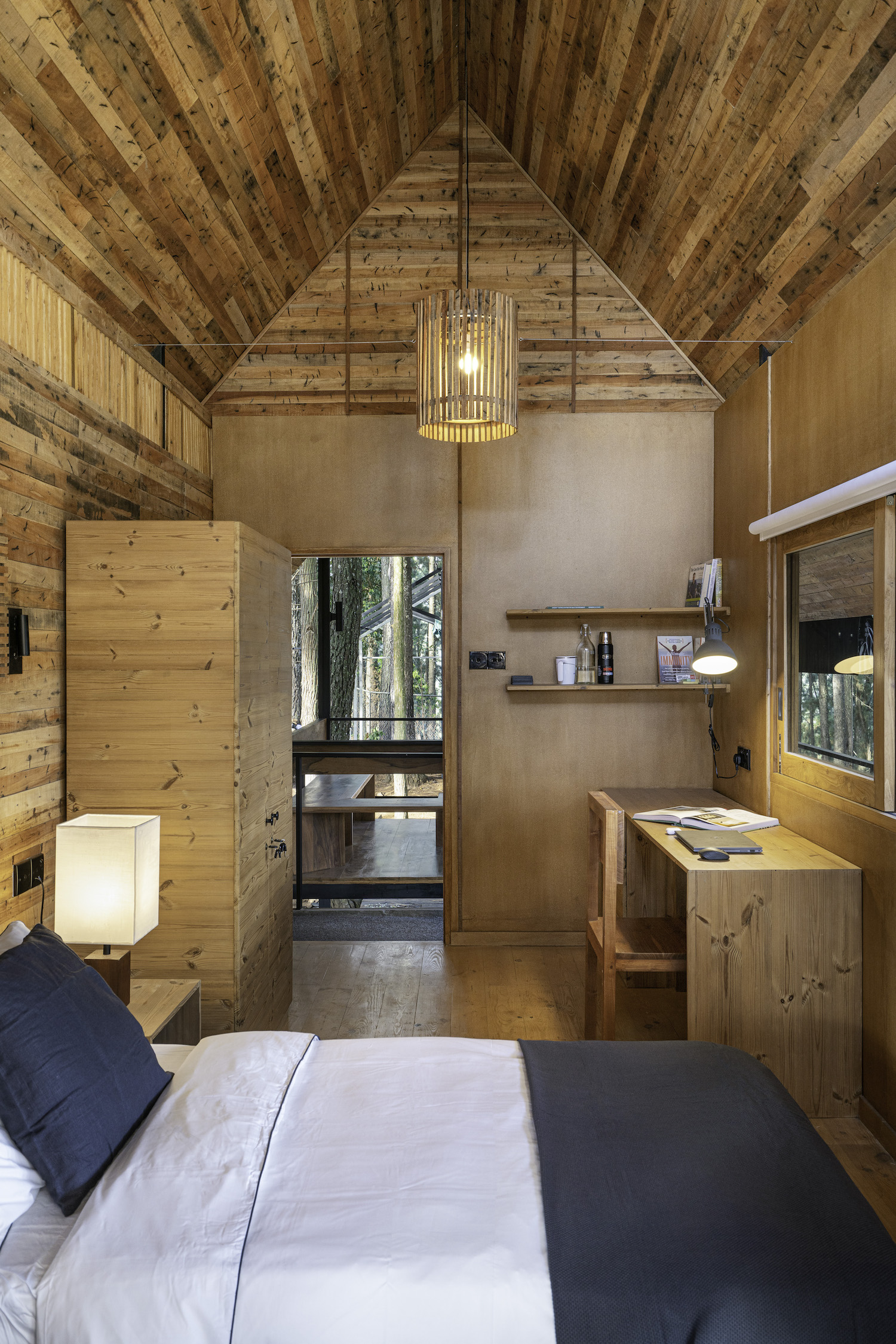 bedroom at a cottage home with pendant lamp 