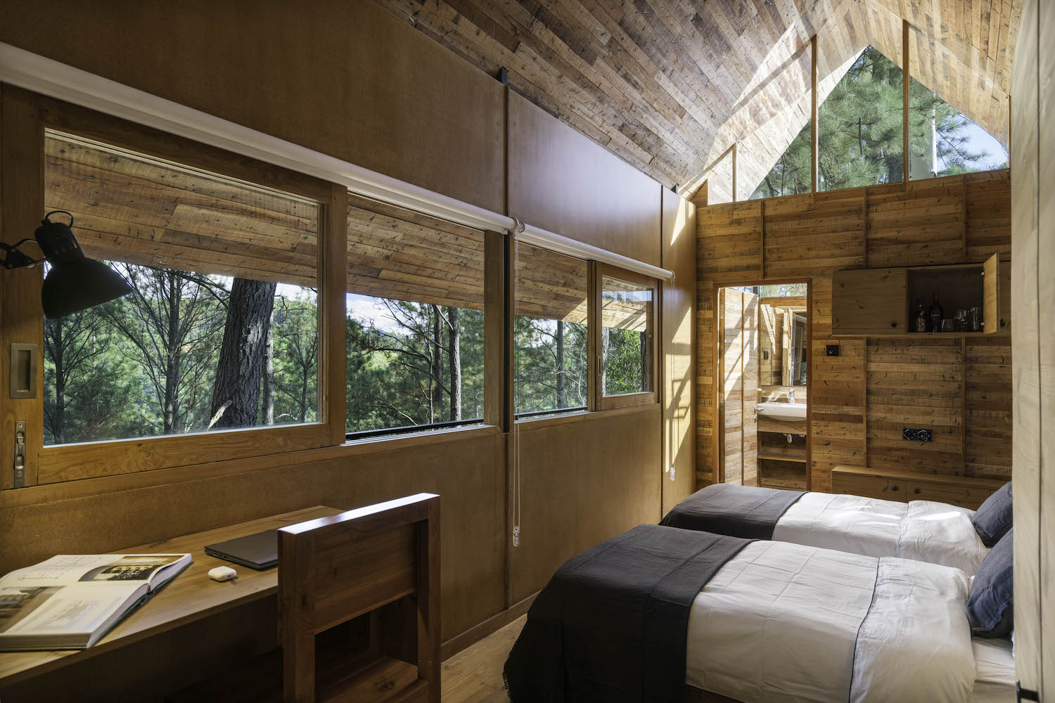 amazing bedroom with forest view through window 