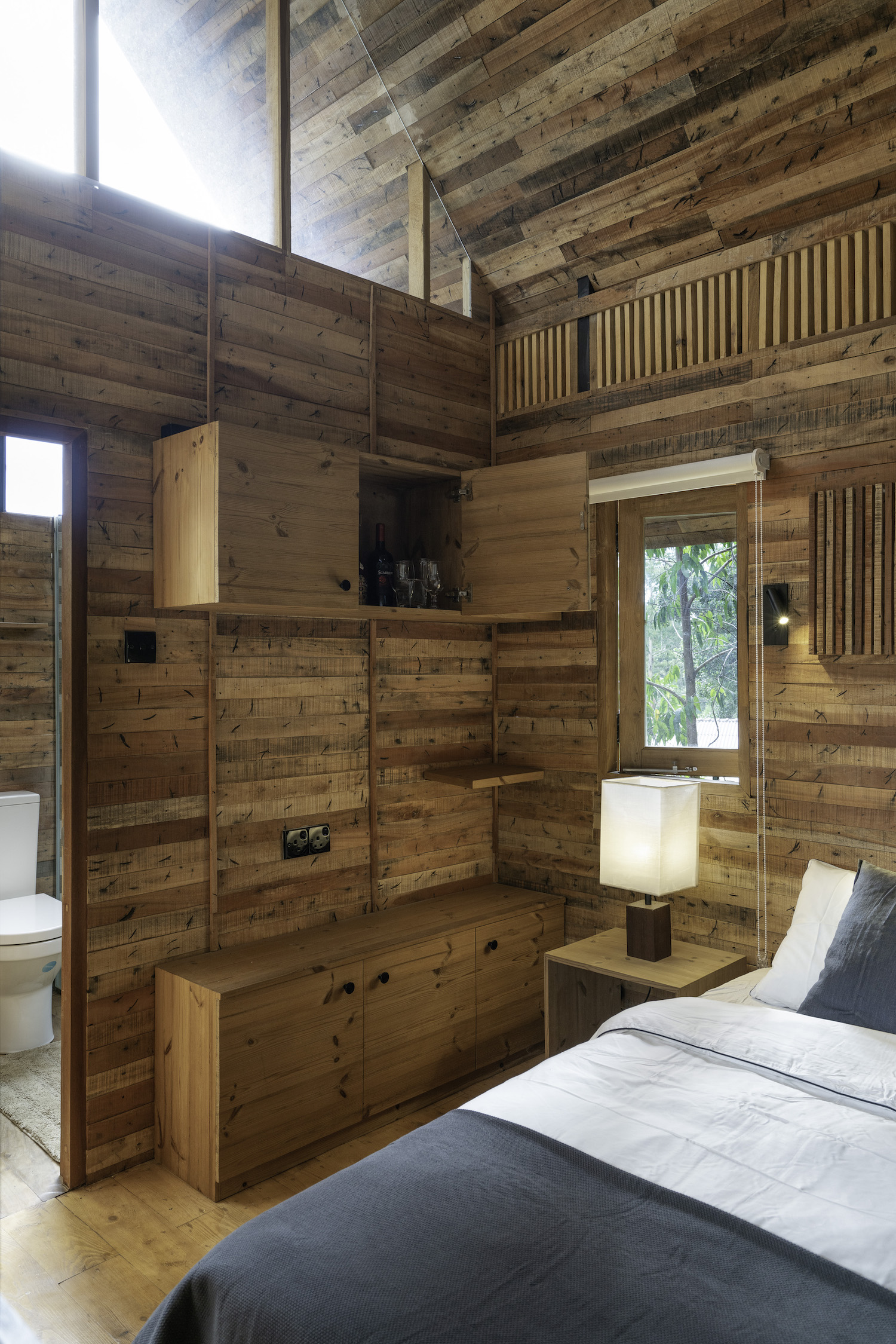 bedroom with timber wood walls 