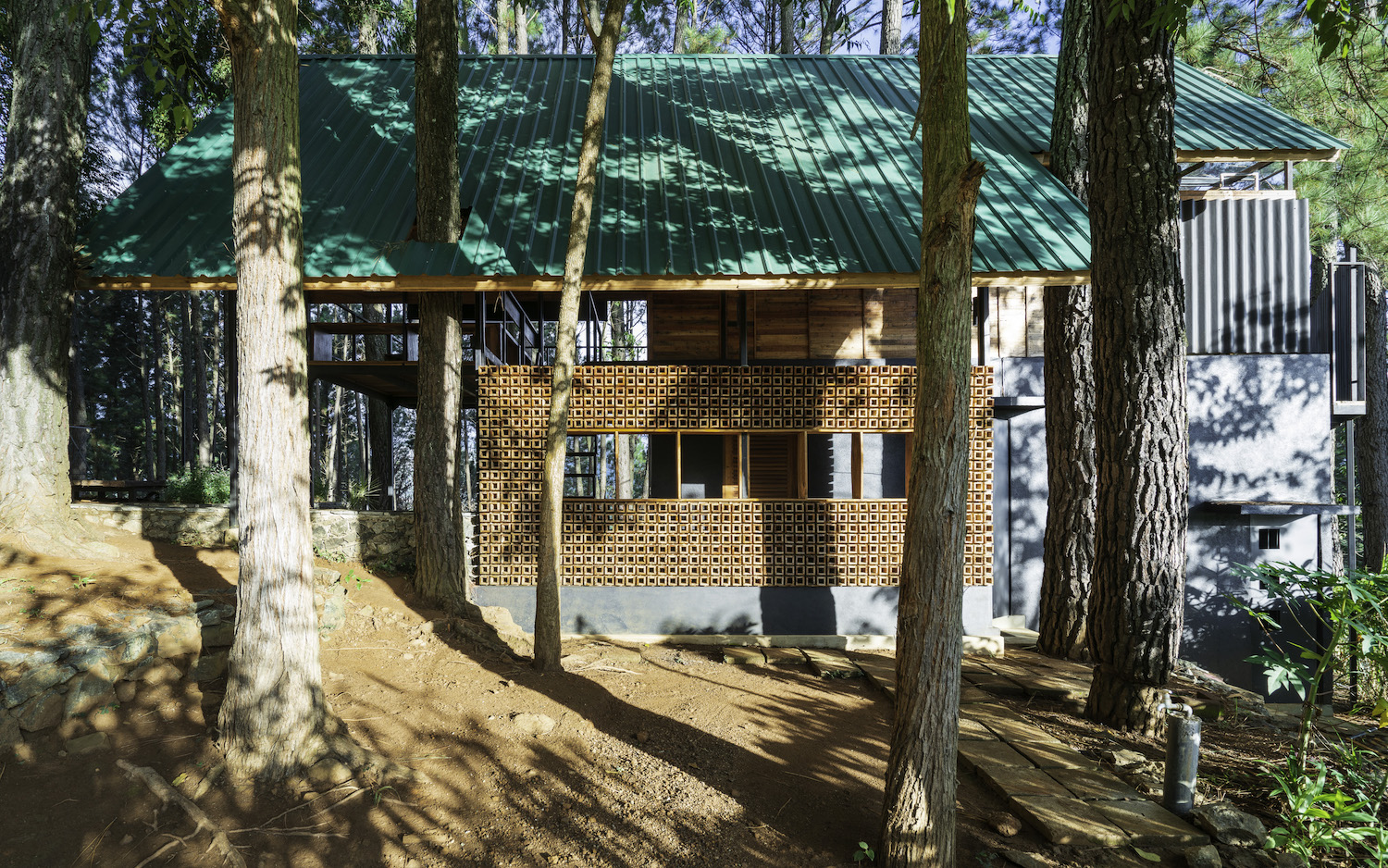 a house among trees in the forest 