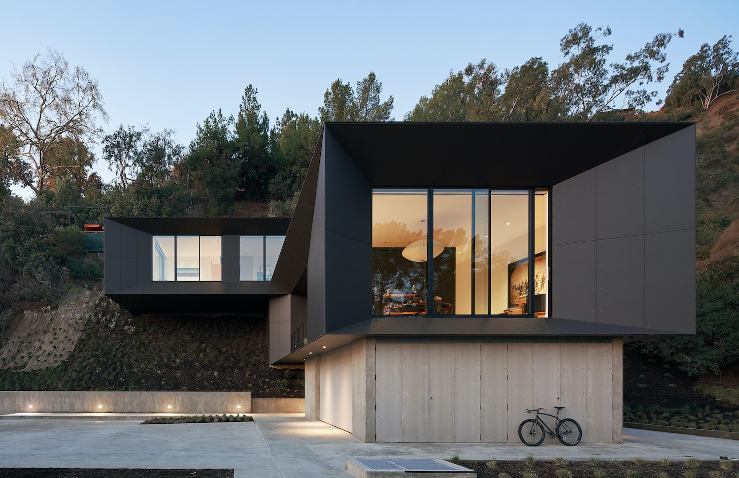 hillside house with black colored facade 