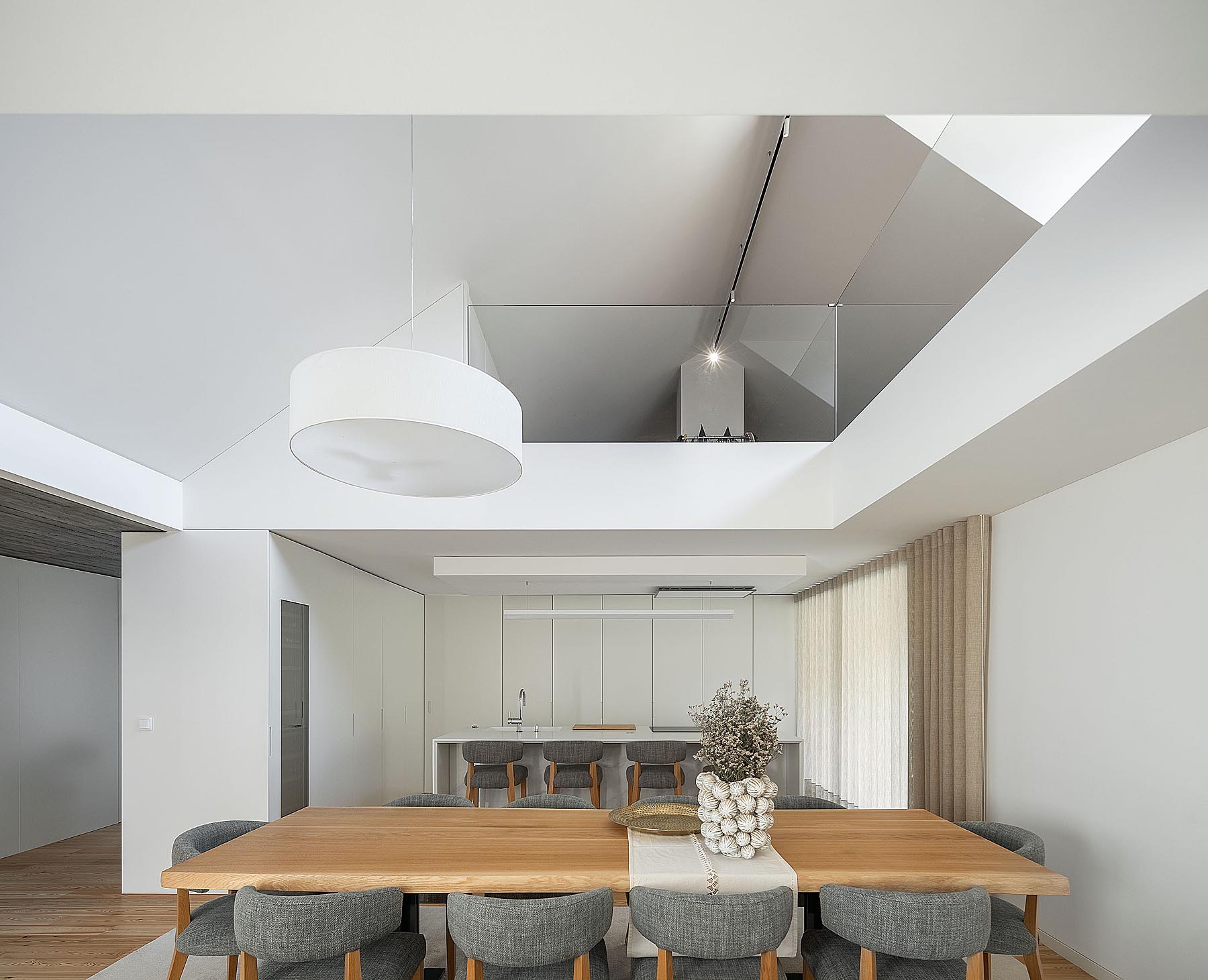 wooden dining table next to kitchen 