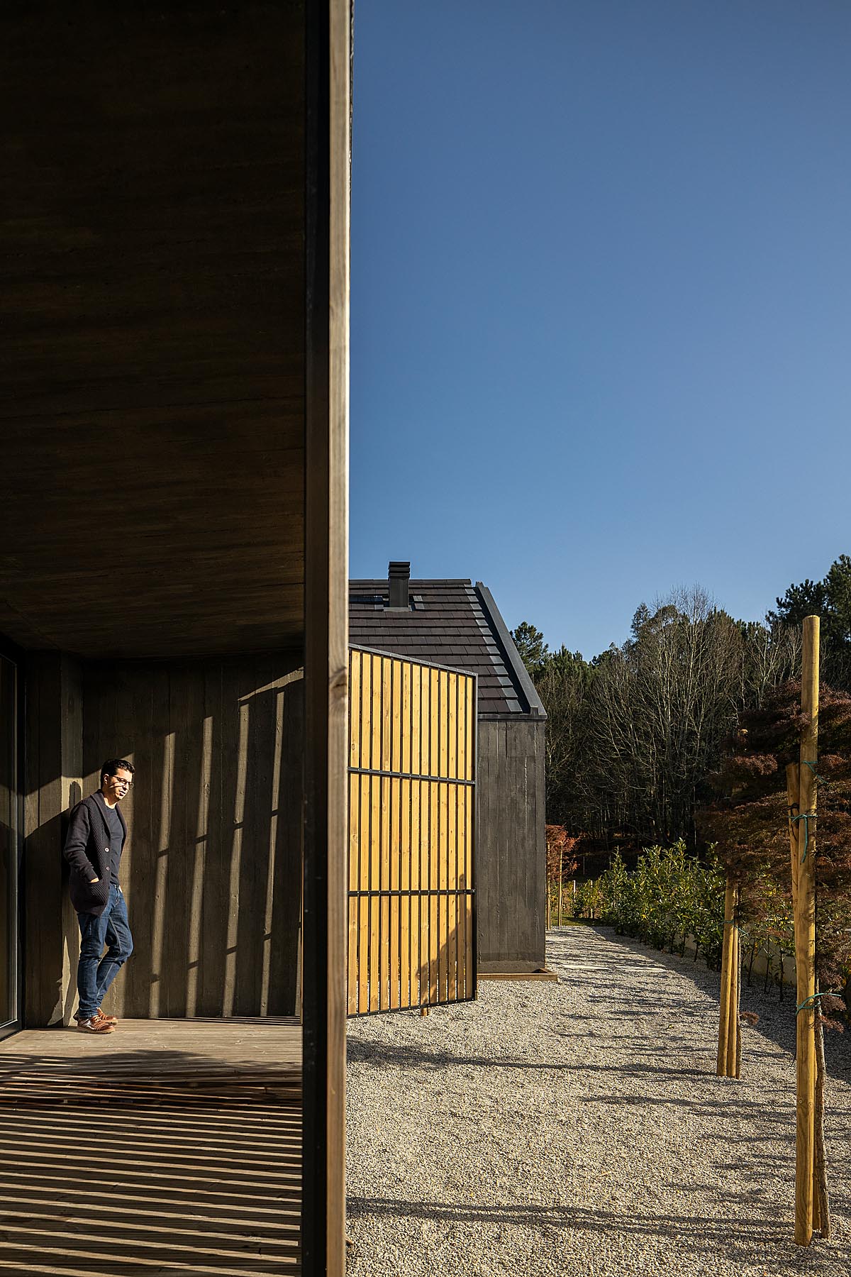 man standing on the deck of the house 