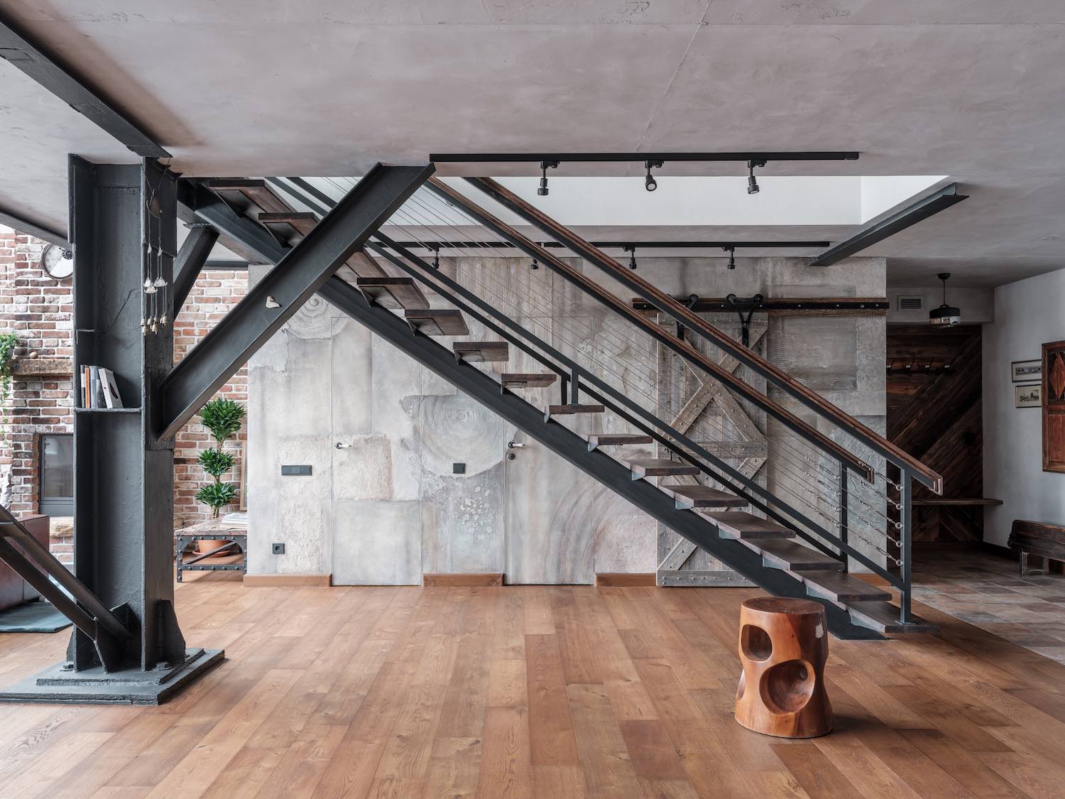 metal staircase connecting the two floors in the duple apartment 