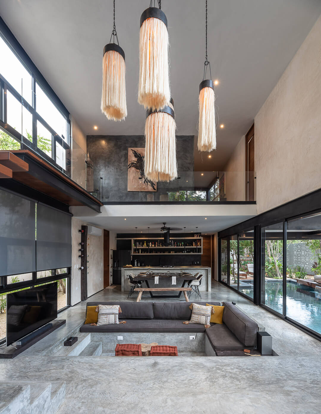 sunken living room with double volume ceiling 