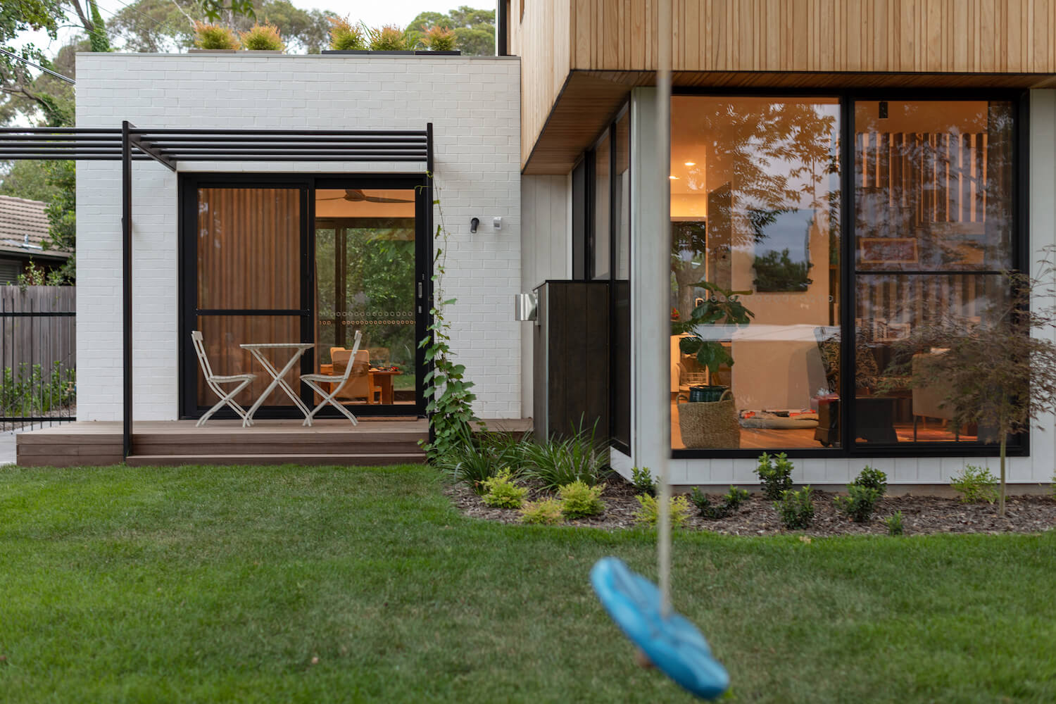 backyard gardena and wooden deck 